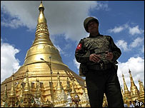 A Burmese soldier patrols Rangoon's landmark Shwedagon Pagoda on 2 October